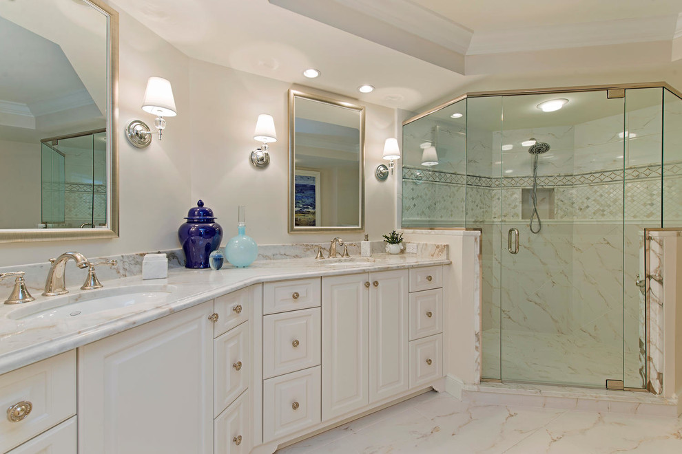 Design ideas for a transitional bathroom in Miami with raised-panel cabinets, white cabinets and a corner shower.