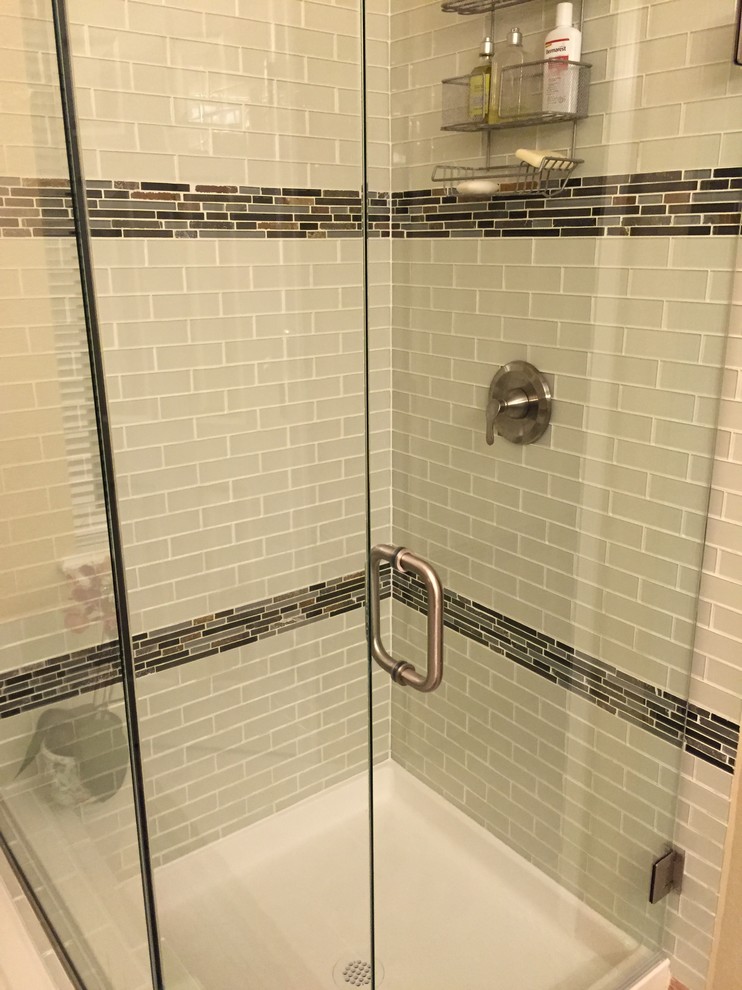 Inspiration for a mid-sized transitional master bathroom in Denver with shaker cabinets, light wood cabinets, a drop-in tub, a corner shower, white tile, subway tile, beige walls, porcelain floors, a vessel sink and granite benchtops.