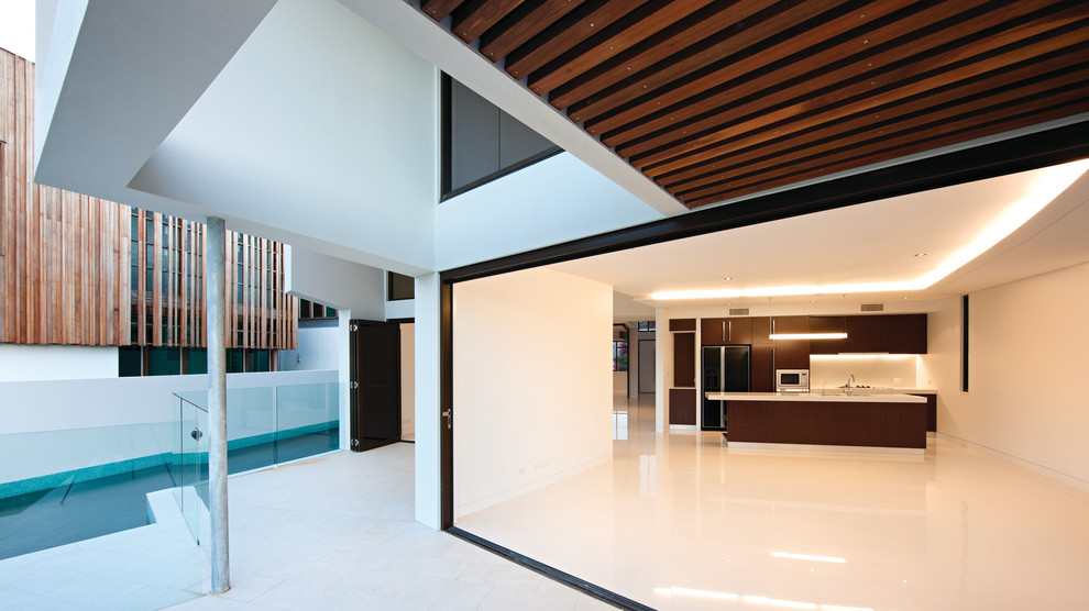 This is an example of a contemporary dining room in Brisbane.