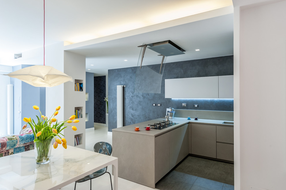 Photo of a mid-sized modern l-shaped open plan kitchen in Rome with an integrated sink, flat-panel cabinets, beige cabinets, quartzite benchtops, grey splashback, marble splashback, stainless steel appliances, painted wood floors, a peninsula and white floor.
