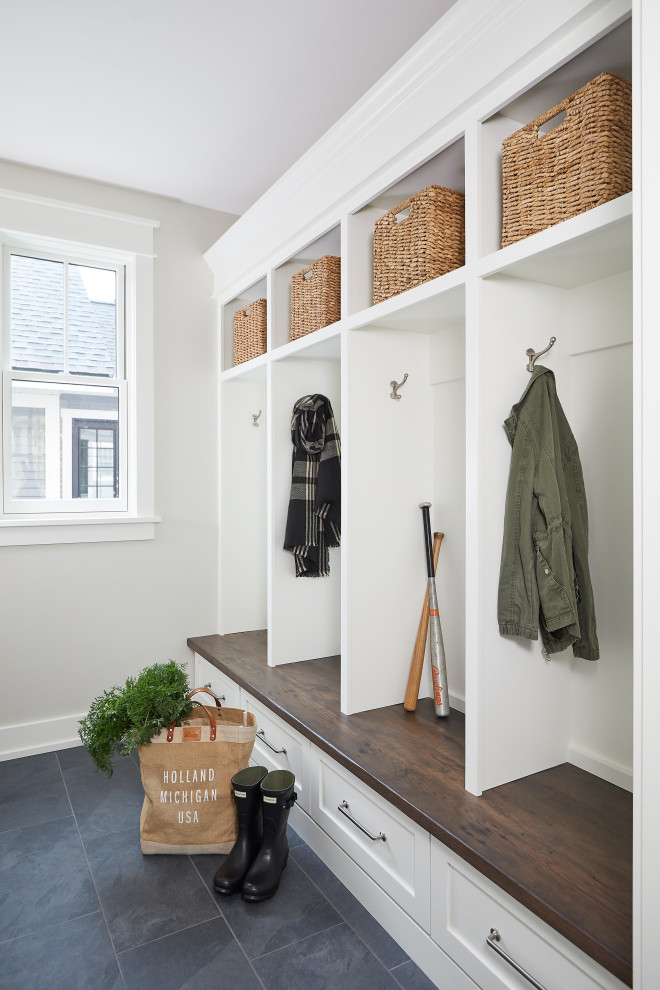 Inspiration for a small country slate floor and blue floor entryway remodel in Grand Rapids with white walls