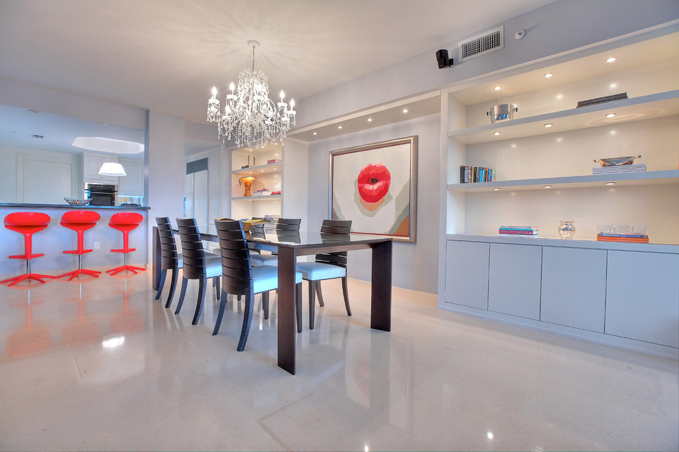 Large contemporary open plan dining in Miami with grey walls and porcelain floors.