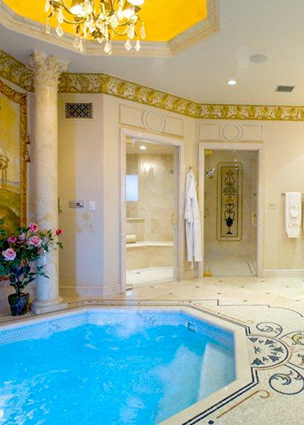This is an example of a large traditional master bathroom in Los Angeles with beige walls and mosaic tile floors.