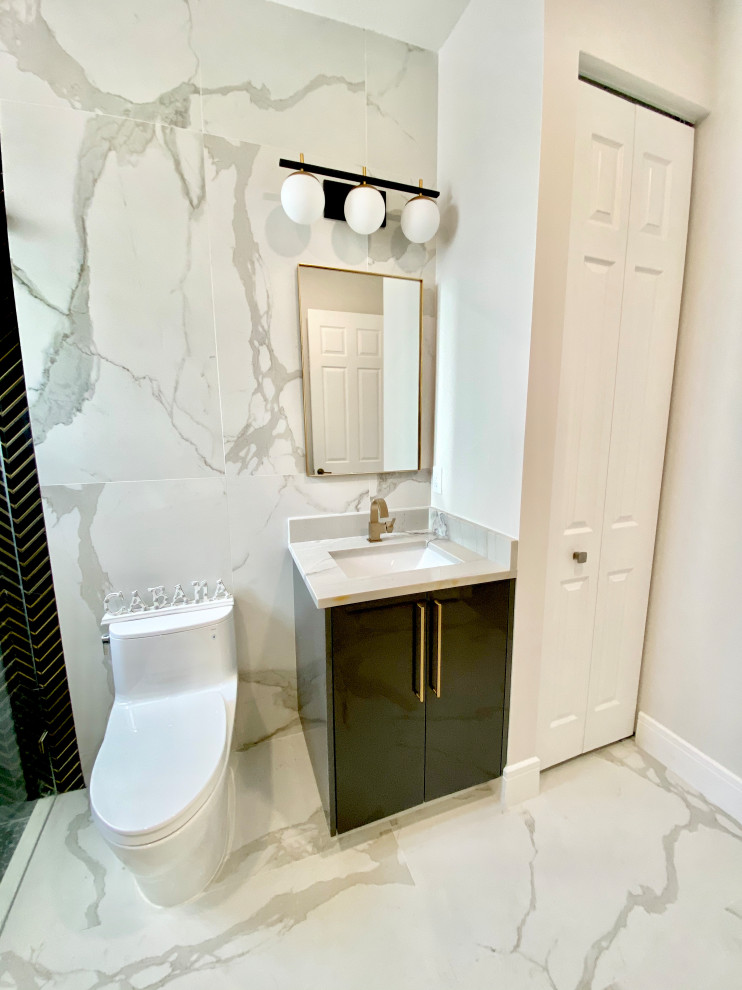 Photo of a mid-sized modern 3/4 bathroom in Miami with flat-panel cabinets, black cabinets, a corner shower, a one-piece toilet, multi-coloured tile, porcelain tile, white walls, porcelain floors, an undermount sink, quartzite benchtops, multi-coloured floor, a hinged shower door, white benchtops, a niche, a single vanity and a built-in vanity.