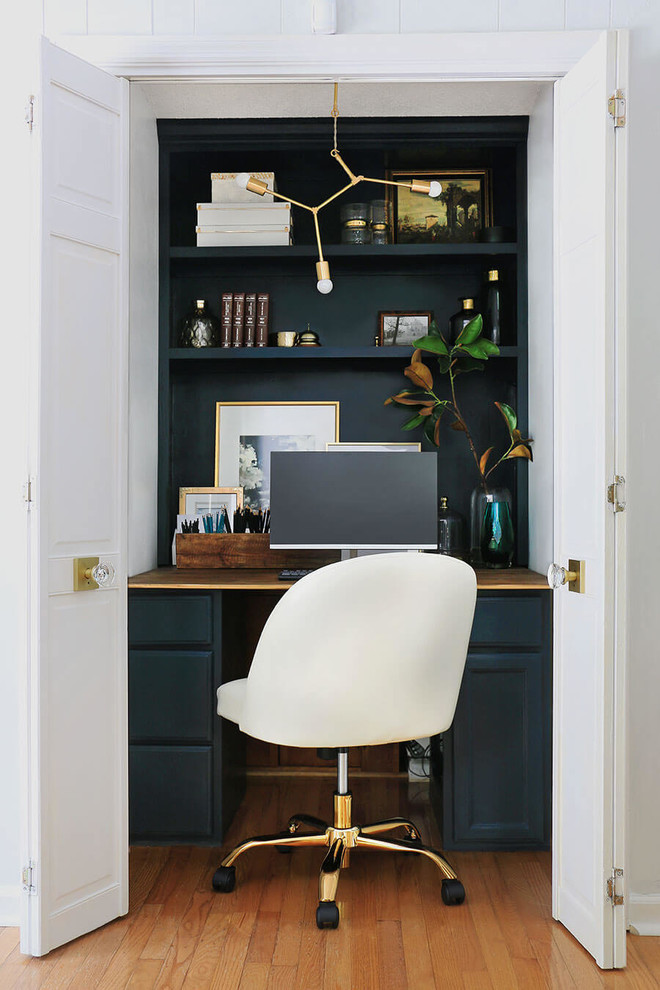 Inspiration for a small modern home office in Other with white walls.