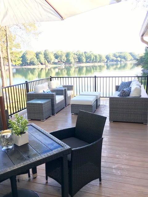 Example of a mid-sized transitional backyard deck design in Charlotte with no cover