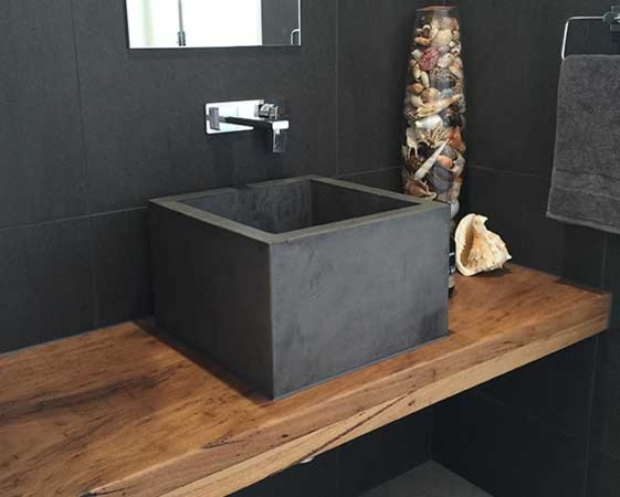 This is an example of a contemporary bathroom in Gold Coast - Tweed with a vessel sink and concrete benchtops.