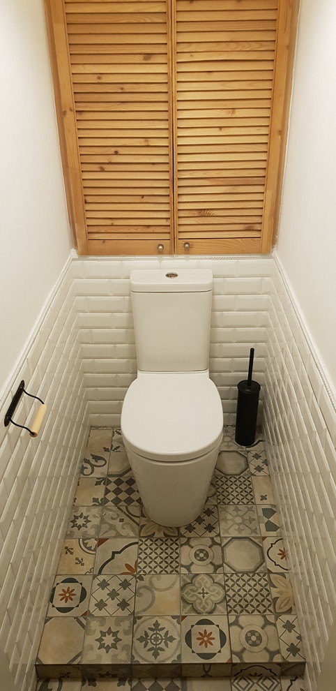 Mid-sized scandinavian powder room in Other.