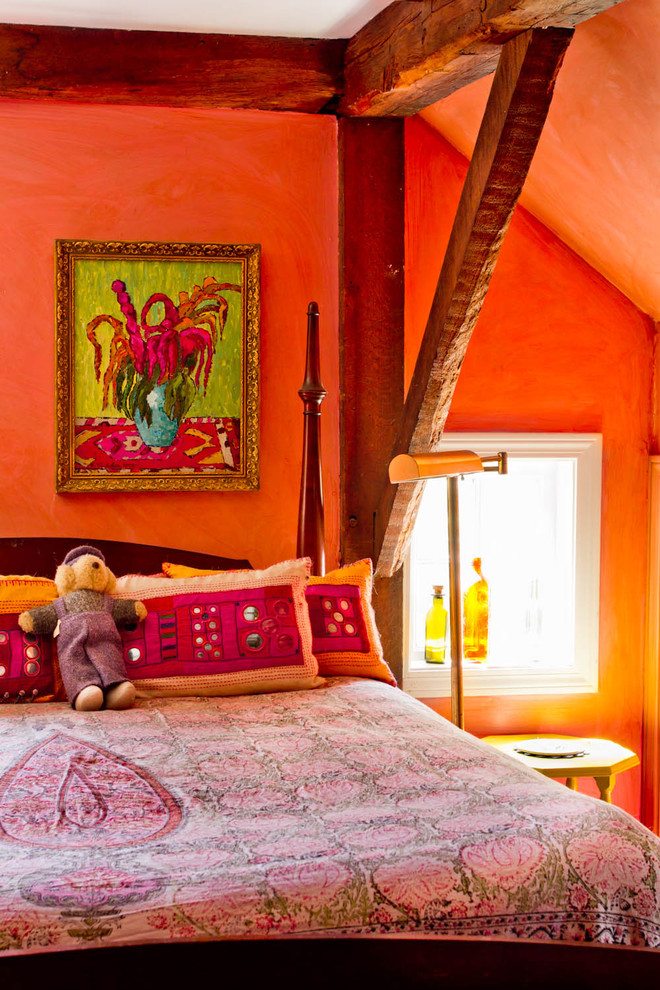 Design ideas for a country bedroom in New York with orange walls.