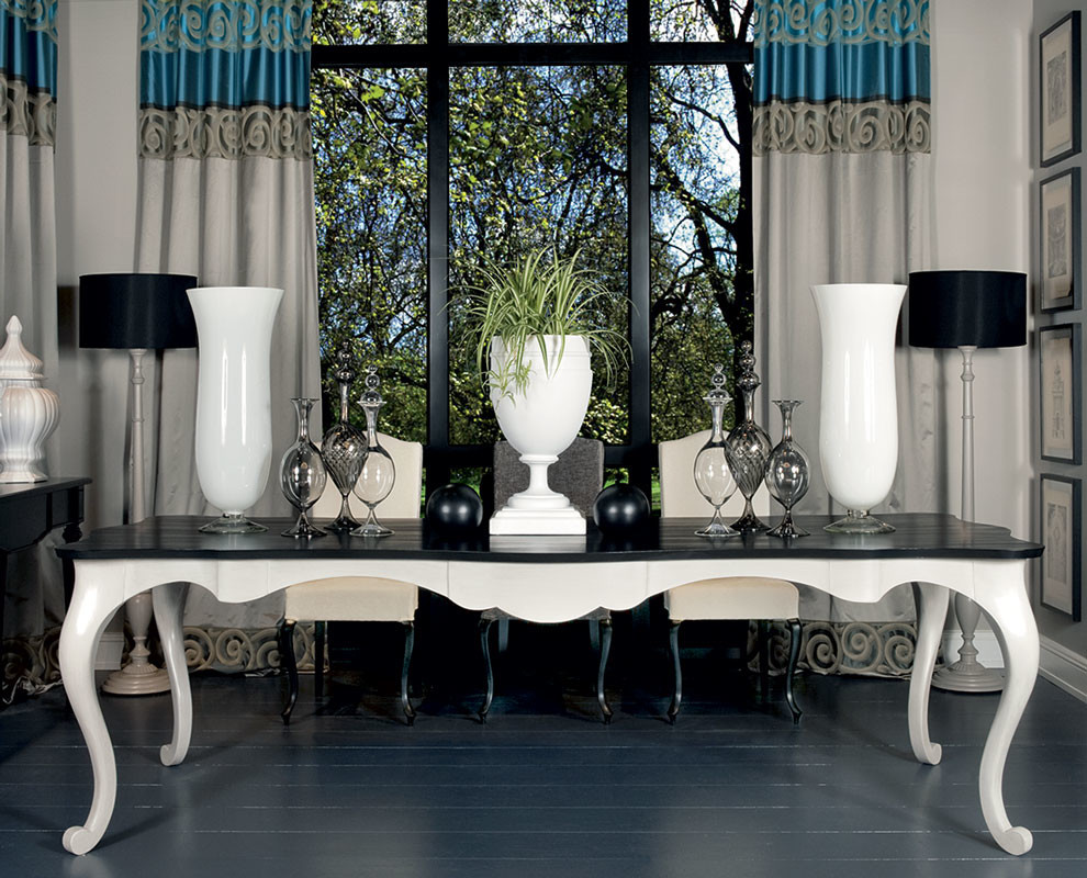 Example of a mid-sized trendy dark wood floor and gray floor enclosed dining room design in London with white walls