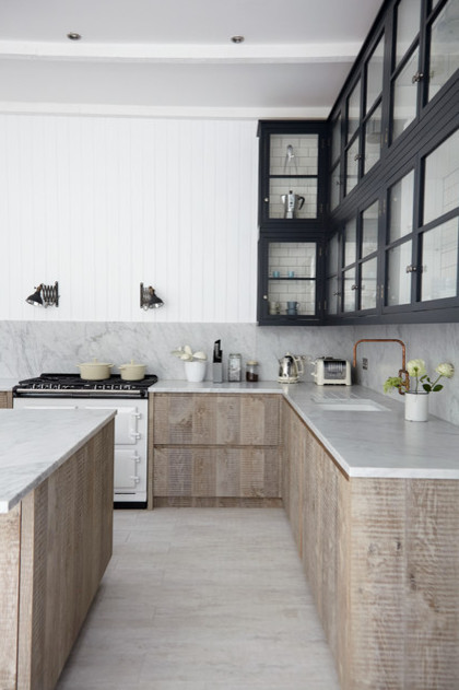 Mid-sized mountain style single-wall porcelain tile eat-in kitchen photo with a farmhouse sink, subway tile backsplash, stainless steel appliances and two islands