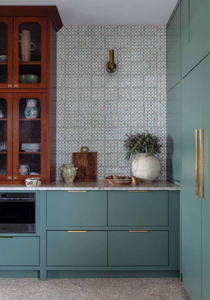 Martindale Water Ski Retreat - Mid-sized trendy galley kitchen pantry photo in Austin with an undermount sink, flat-panel cabinets, green cabinets, quartzite countertops, white backsplash, terra-cotta backsplash, stainless steel appliances, a peninsula and beige countertops