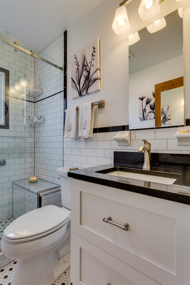 Photo of a small transitional 3/4 bathroom in DC Metro with shaker cabinets, white cabinets, a corner shower, white tile and engineered quartz benchtops.