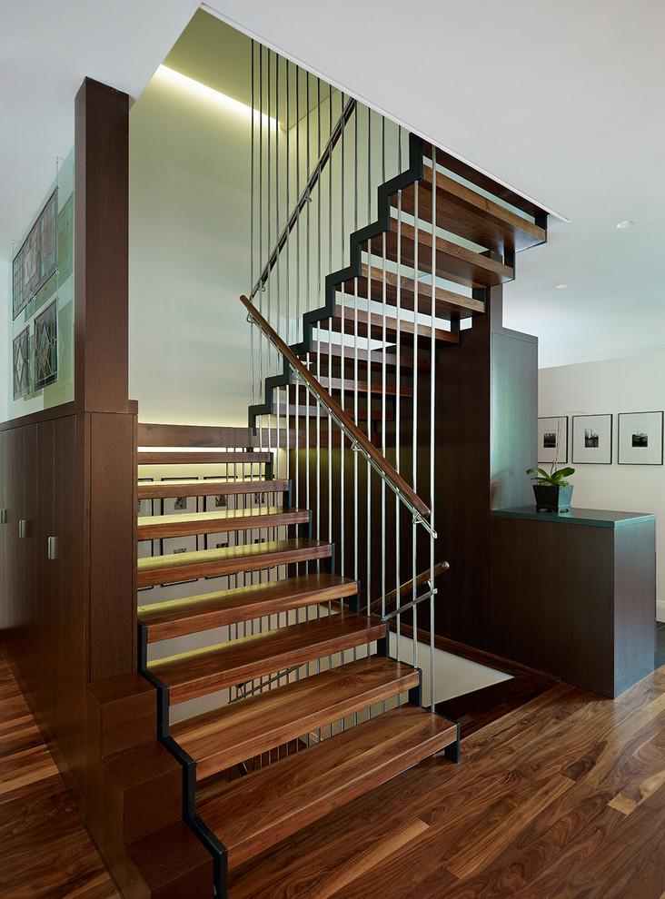 Mid-sized contemporary wood u-shaped staircase in Toronto with open risers.
