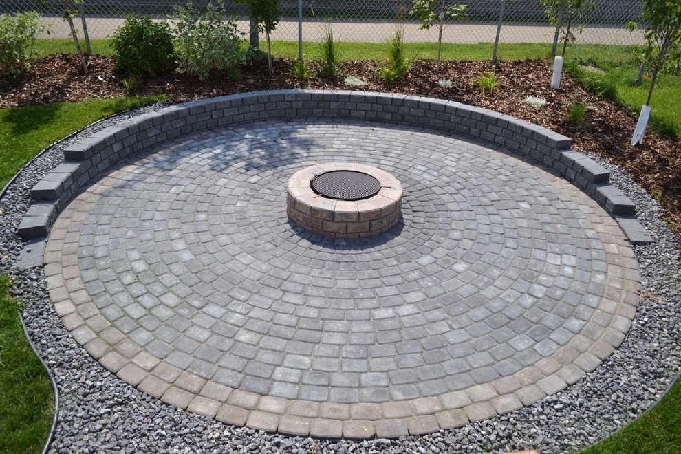 Inspiration for a mid-sized traditional backyard partial sun outdoor sport court for summer in Edmonton with brick pavers.