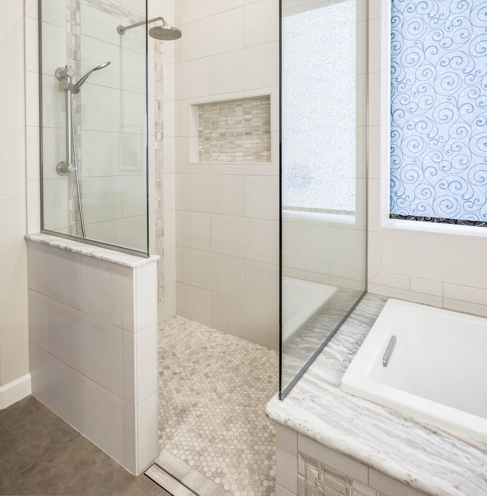 Drop-in bathtub - mid-sized transitional master gray tile and porcelain tile porcelain tile and brown floor drop-in bathtub idea in Phoenix with shaker cabinets, medium tone wood cabinets, a two-piece toilet, white walls, an undermount sink and granite countertops