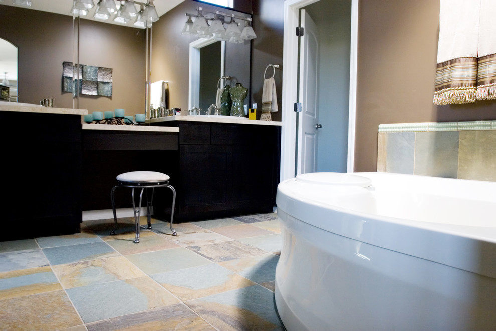 Inspiration for a transitional master bathroom in DC Metro with flat-panel cabinets, black cabinets, a freestanding tub, brown walls and slate floors.