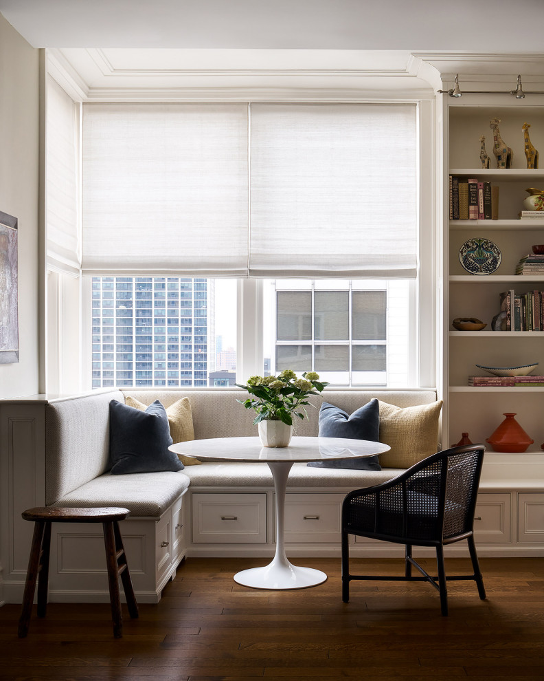 Breakfast nook - transitional medium tone wood floor and brown floor breakfast nook idea in Chicago with beige walls