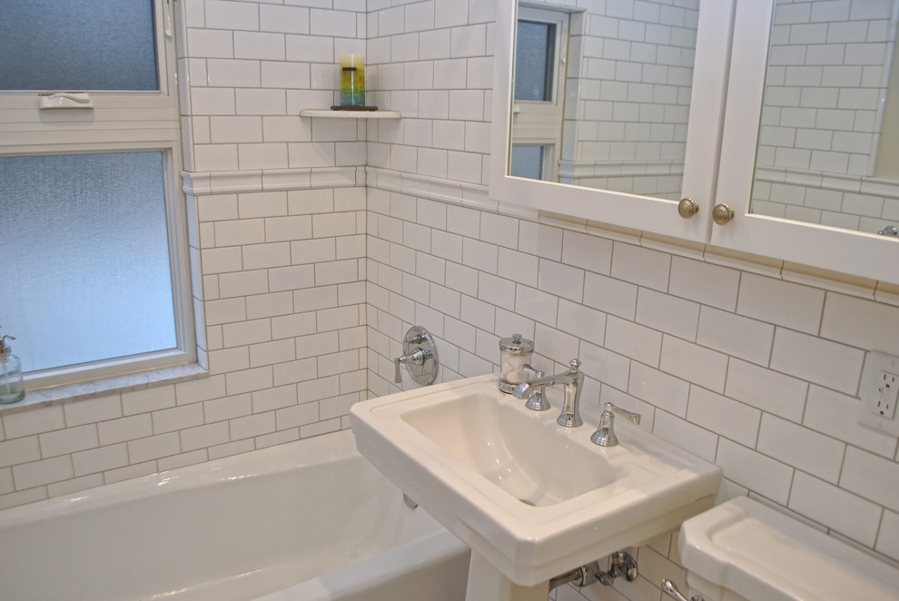 Example of a small 1960s white tile and ceramic tile mosaic tile floor bathroom design in Minneapolis with a pedestal sink, marble countertops, a two-piece toilet, white walls, shaker cabinets and white cabinets