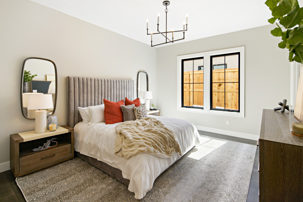 This is an example of an expansive modern guest bedroom in Portland.