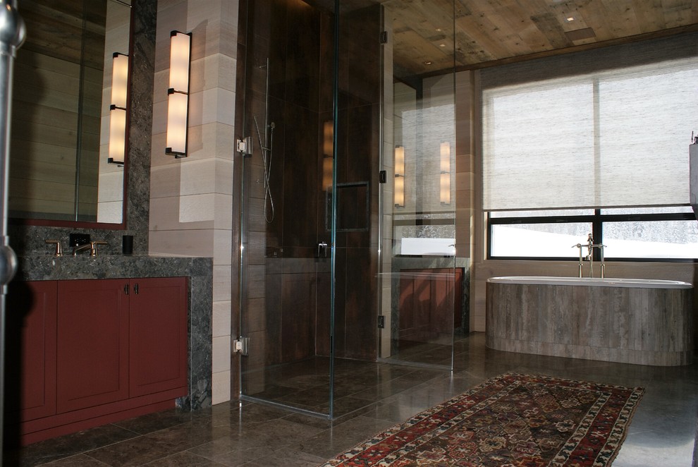 Design ideas for a large country master bathroom in Denver with shaker cabinets, red cabinets, a drop-in tub, an alcove shower, a one-piece toilet, brown tile, gray tile, porcelain tile, beige walls, porcelain floors, an undermount sink and granite benchtops.
