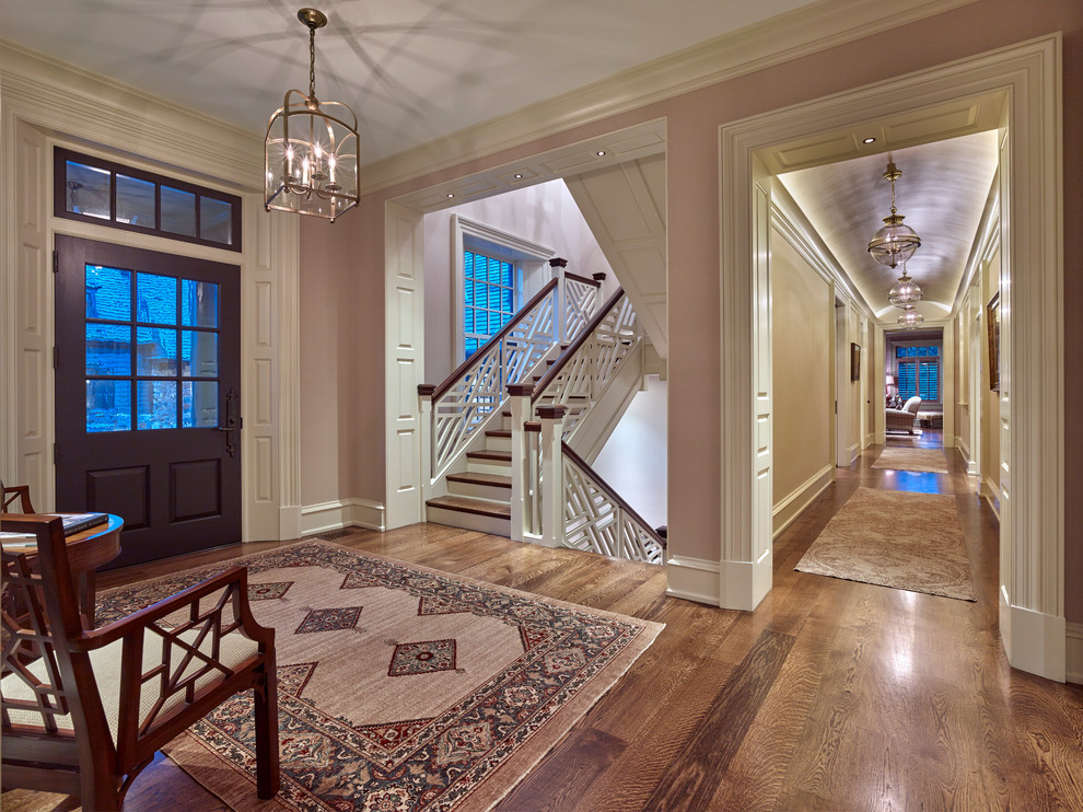 Inspiration for a large traditional entryway in Philadelphia with purple walls, medium hardwood floors, a single front door and a purple front door.