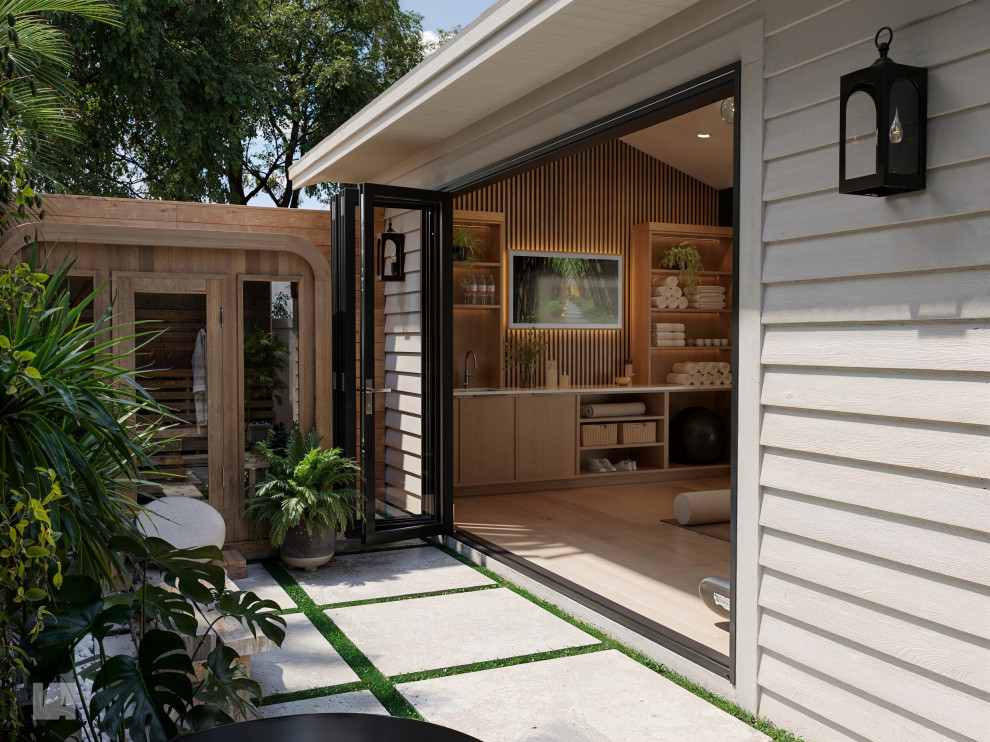 Inspiration for a mid-sized modern white one-story wood and board and batten house exterior remodel in Tampa with a hip roof, a shingle roof and a gray roof