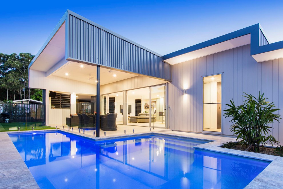 Photo of a contemporary custom-shaped pool in Brisbane.