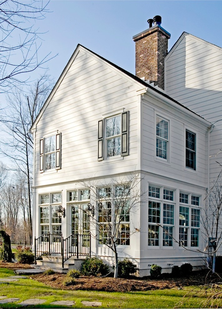 This is an example of a traditional exterior in Philadelphia with wood siding.