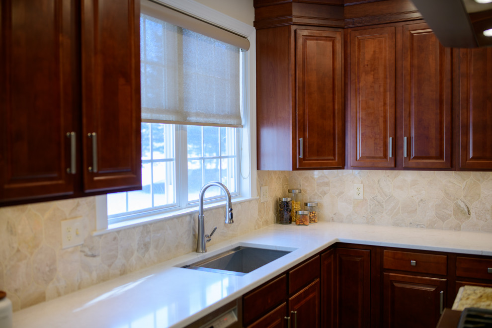 Inspiration for a mediterranean kitchen remodel in Baltimore with quartz countertops, beige backsplash, marble backsplash and white countertops