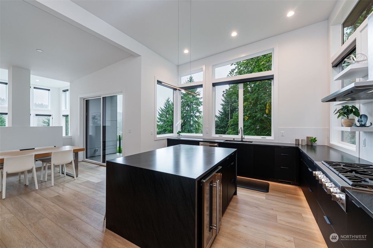 This contemporary custom home was designed to emphasize clean architectural lines, expansive natural light, and a strong connection between the indoor and outdoor living spaces. Large floor-to-ceiling