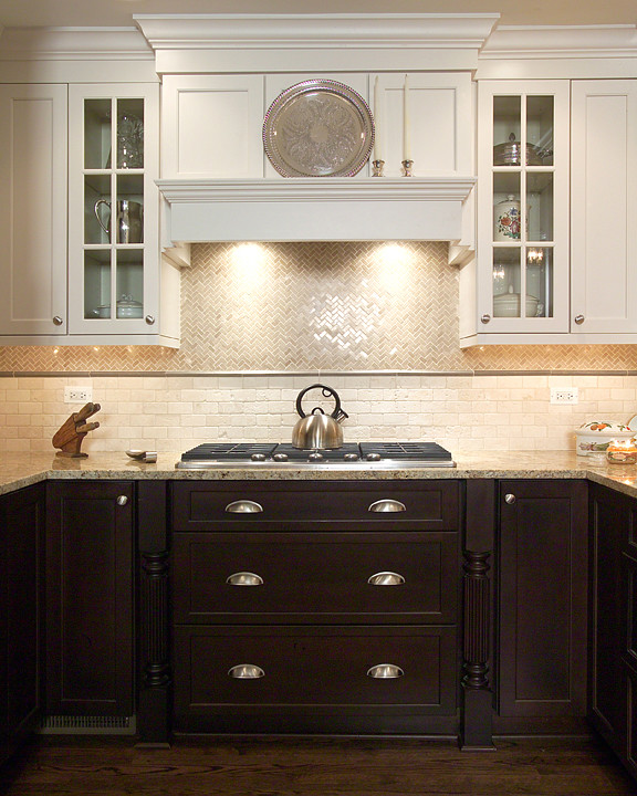 Transitional u-shaped eat-in kitchen photo in Chicago with an undermount sink, flat-panel cabinets, granite countertops, beige backsplash, stone tile backsplash and stainless steel appliances
