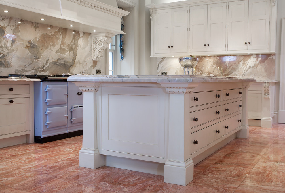 Inspiration for a mid-sized country u-shaped open plan kitchen in Cheshire with a drop-in sink, shaker cabinets, white cabinets, granite benchtops, multi-coloured splashback, marble splashback, stainless steel appliances, ceramic floors, with island and red floor.