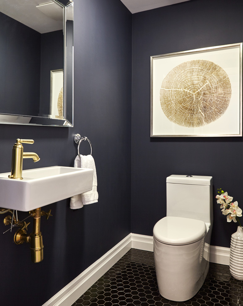 Inspiration for a small transitional powder room in Toronto with a one-piece toilet, black tile, ceramic tile, blue walls, ceramic floors and a wall-mount sink.