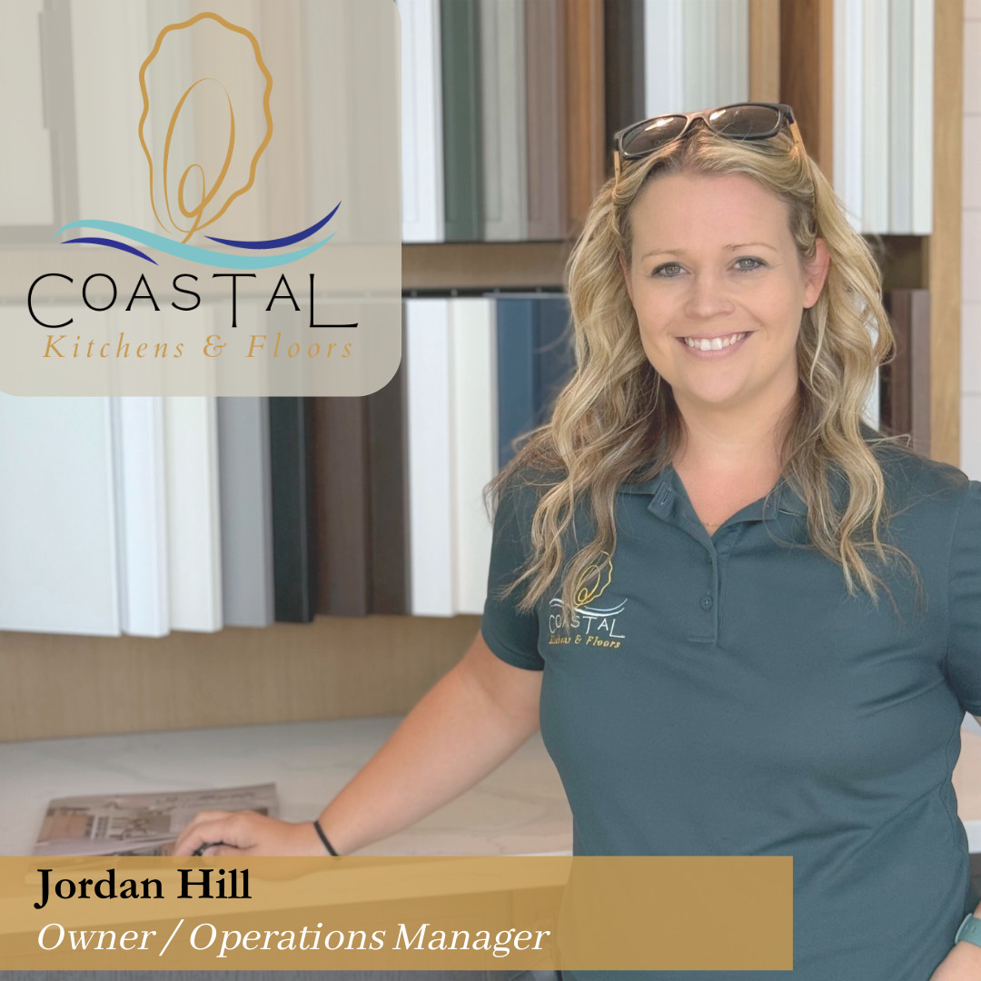 Jordan Bio Photo standing in front of cabinet display