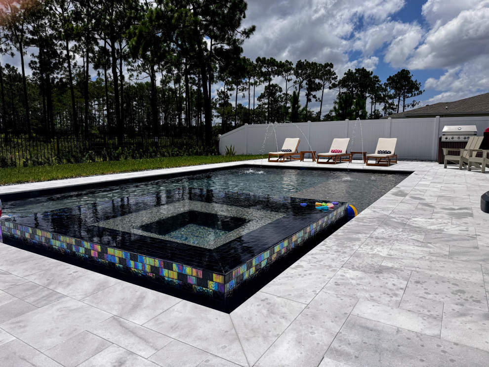 St. Cloud pool with overflow perimeter spa and sun shelf