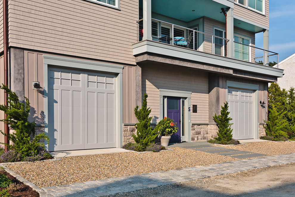 Small contemporary front yard full sun driveway in Boston with natural stone pavers.