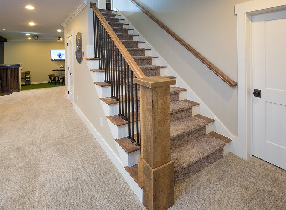 Photo of a large country wood straight staircase in Columbus with painted wood risers.