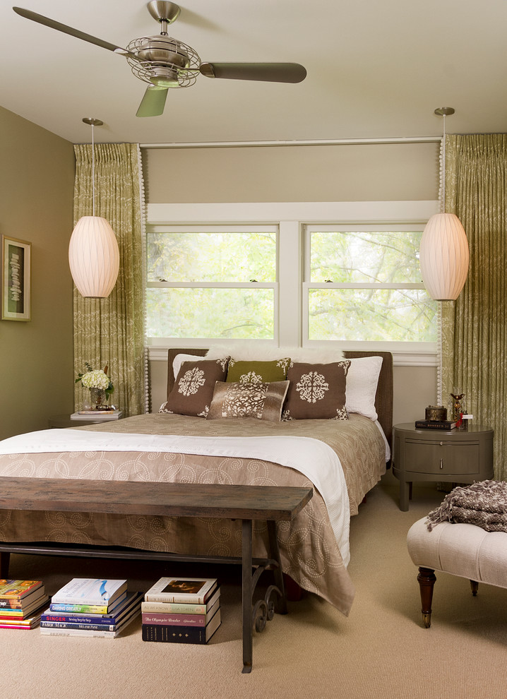 This is an example of a transitional master bedroom in Minneapolis with beige walls, carpet and beige floor.