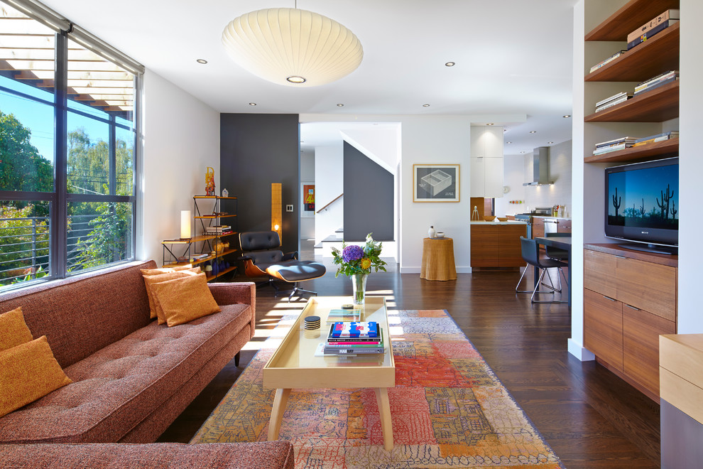 Mid-sized contemporary open concept living room in San Francisco with white walls and dark hardwood floors.
