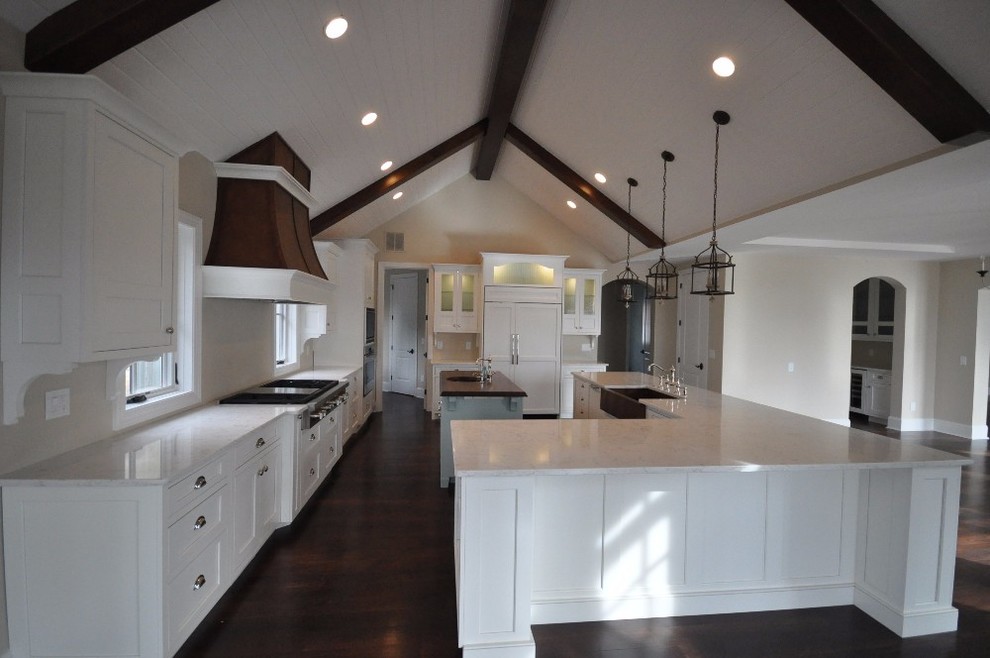 Inspiration for a large modern u-shaped dark wood floor eat-in kitchen remodel with a drop-in sink, recessed-panel cabinets, white cabinets, granite countertops, stainless steel appliances and an island