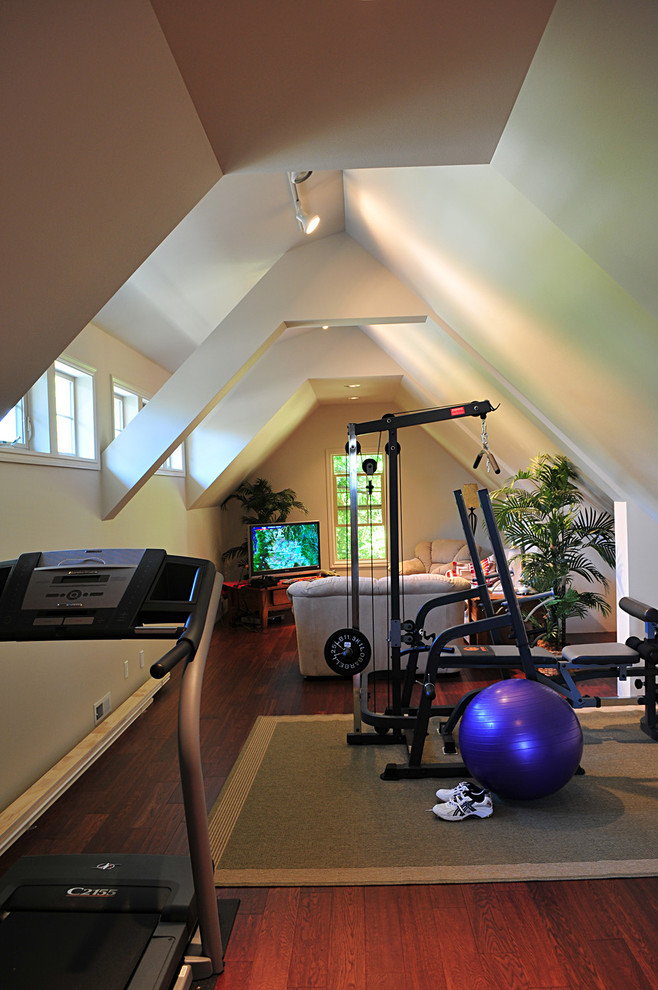Inspiration for a large traditional multipurpose gym in Seattle with beige walls and dark hardwood floors.