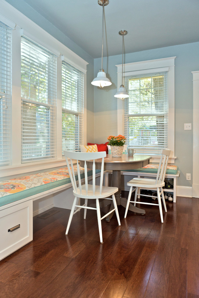 Photo of a transitional dining room in St Louis with medium hardwood floors.