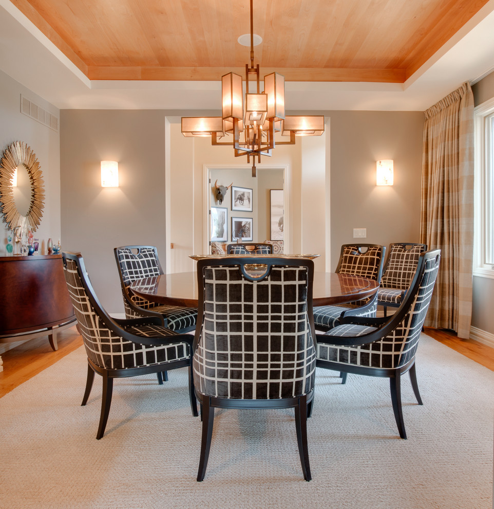 Inspiration for a large transitional separate dining room in Denver with beige walls and light hardwood floors.