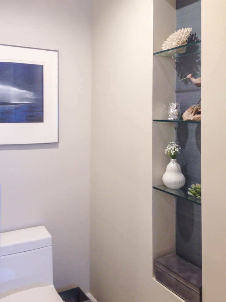 Large transitional master multicolored tile and stone tile porcelain tile and multicolored floor bathroom photo with flat-panel cabinets, black cabinets, a one-piece toilet, beige walls and wood countertops