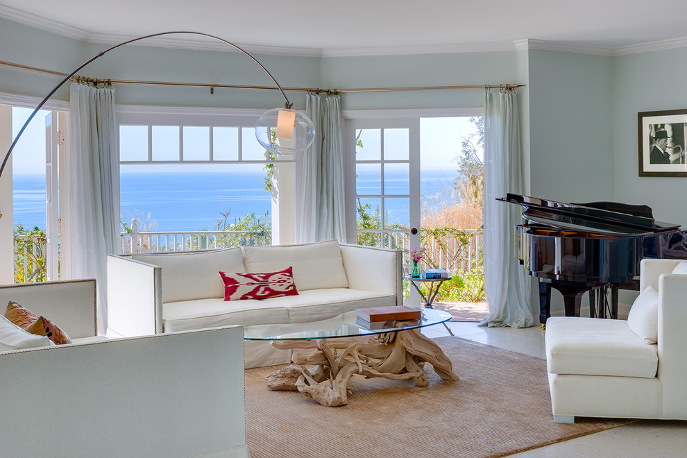 Transitional living room in Los Angeles with a music area and blue walls.