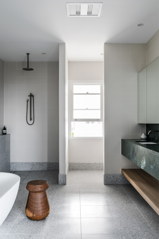 Inspiration for a large contemporary master bathroom in Brisbane with black cabinets, a freestanding tub, an open shower, gray tile, grey walls, terrazzo floors, marble benchtops, an open shower and a double vanity.
