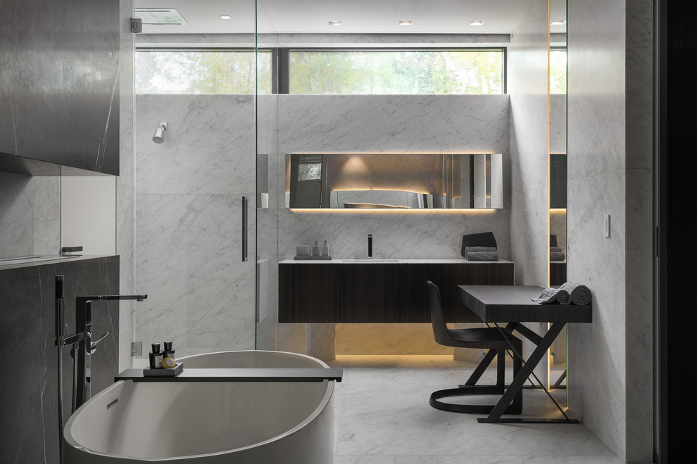 This is an example of a large modern master bathroom in Miami with flat-panel cabinets, brown cabinets, a freestanding tub, a corner shower, white walls, marble floors, an undermount sink, white floor, a hinged shower door and white benchtops.