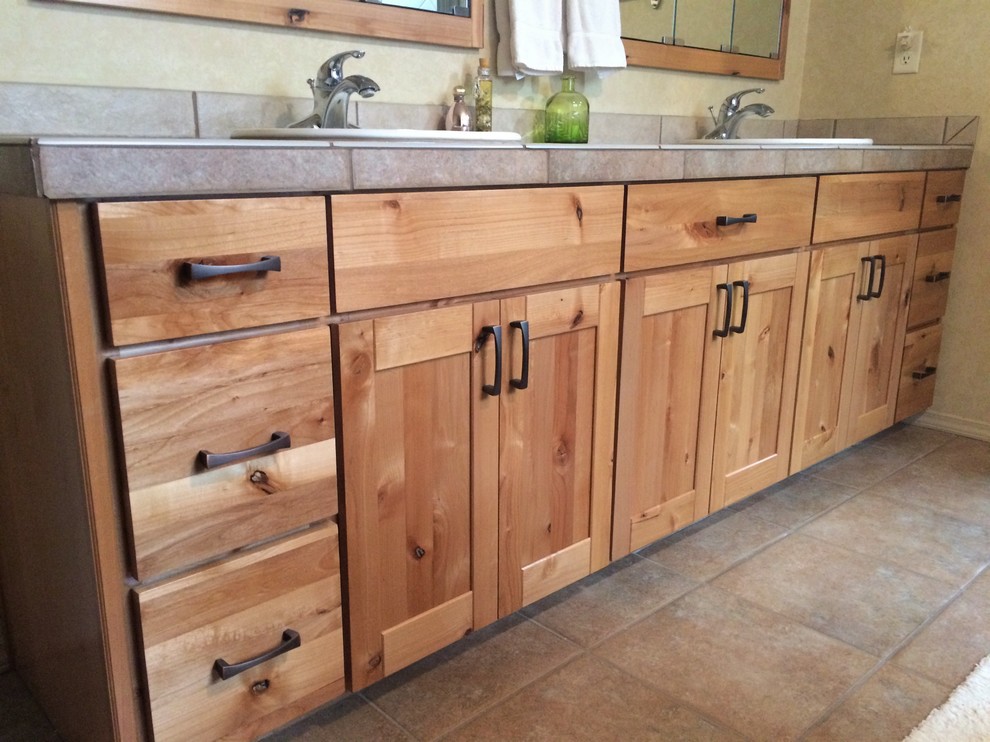 Mid-sized mountain style master bathroom photo in Phoenix with shaker cabinets, light wood cabinets and tile countertops