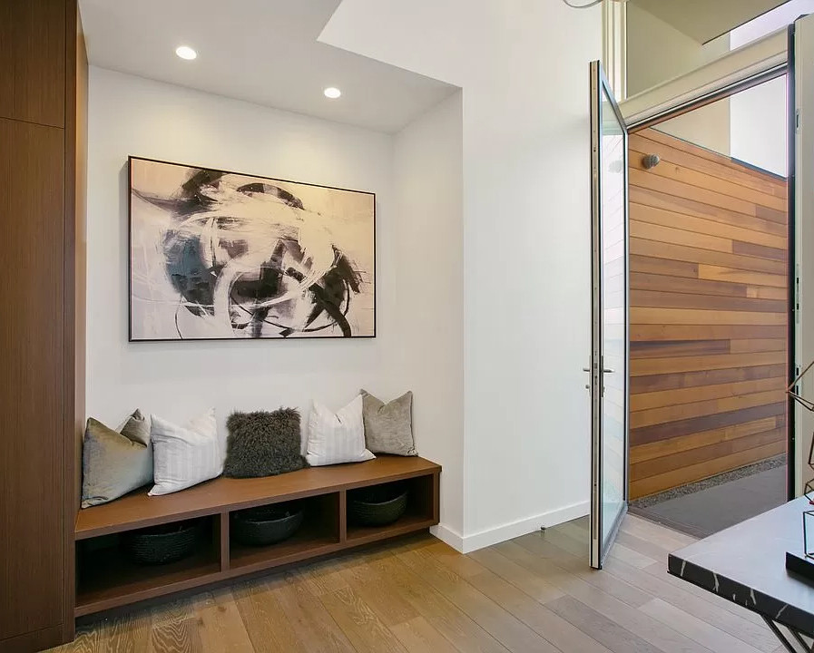Front hall with custom walnut cabinetry.
